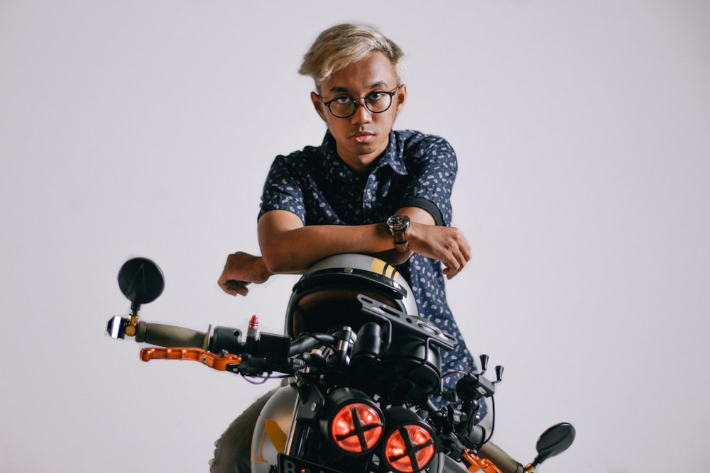 selective focus photo of man riding motorcycle