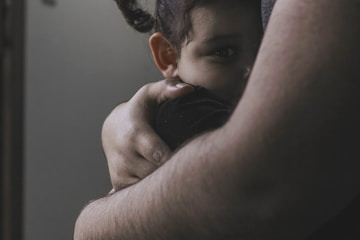 Adult comforting child