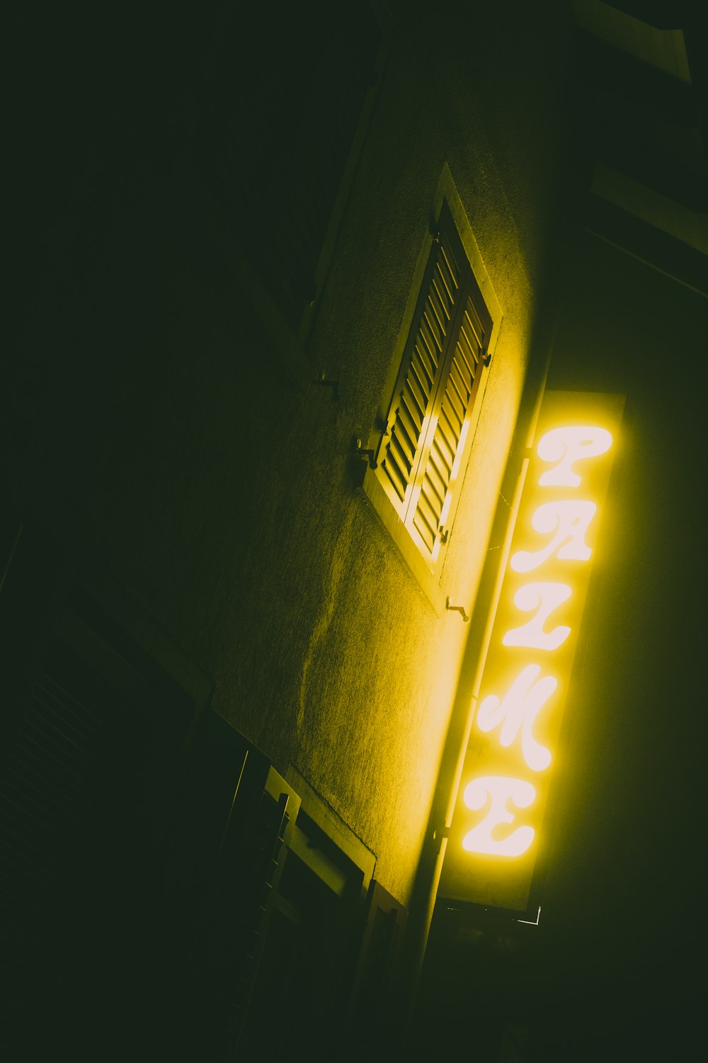 yellow neon light beside window