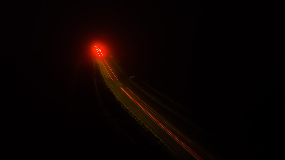 time lapse and light streaks of vehicle on road