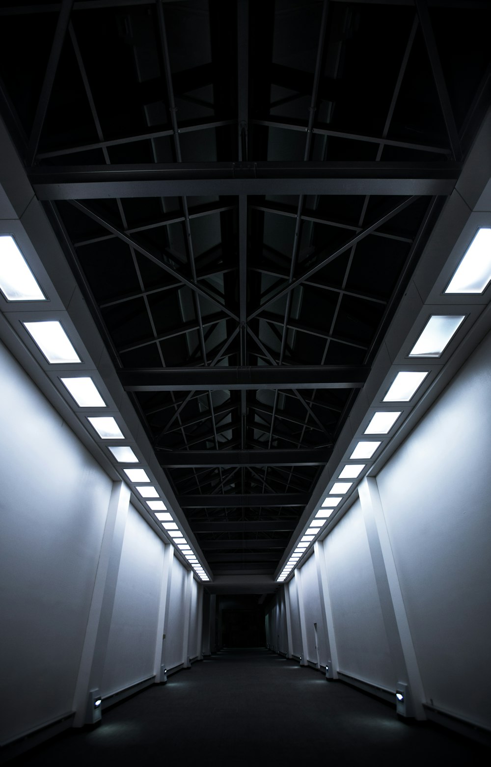 white and gray concrete hallway