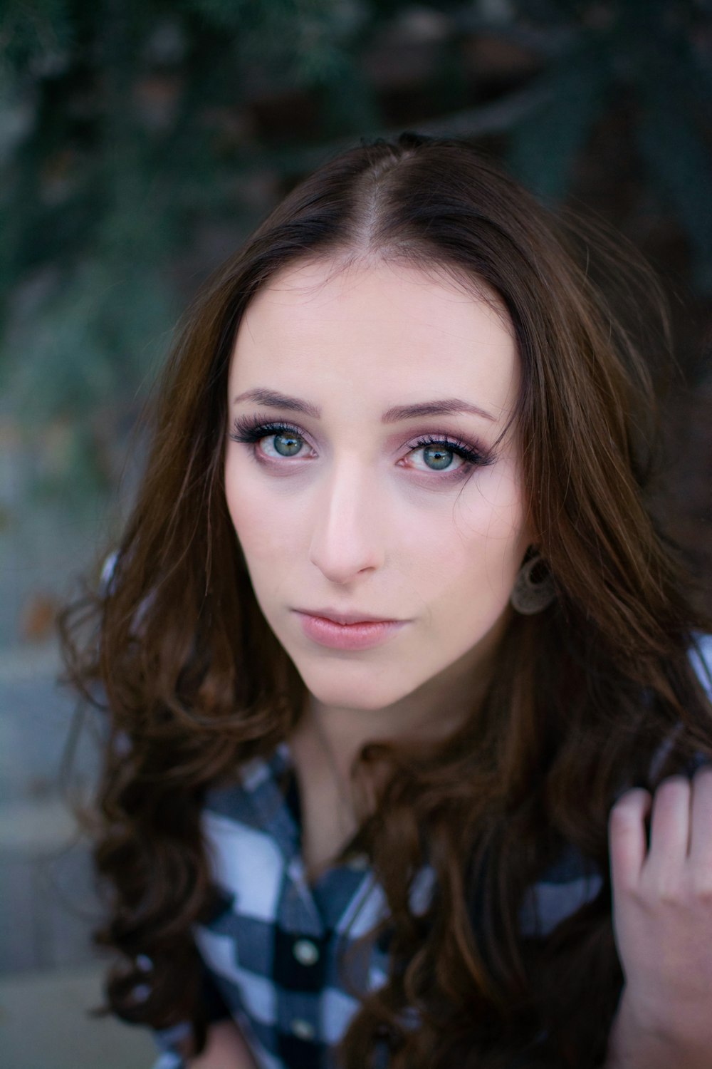 portrait of woman wearing gray and black top