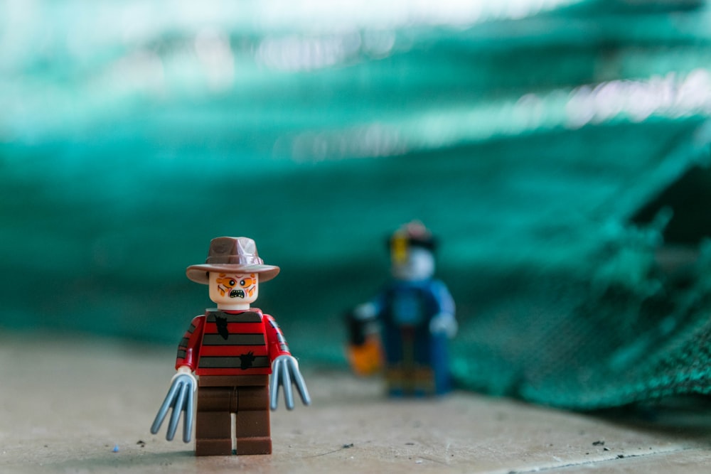 focus photography of Lego Freddy Krueger Minifig