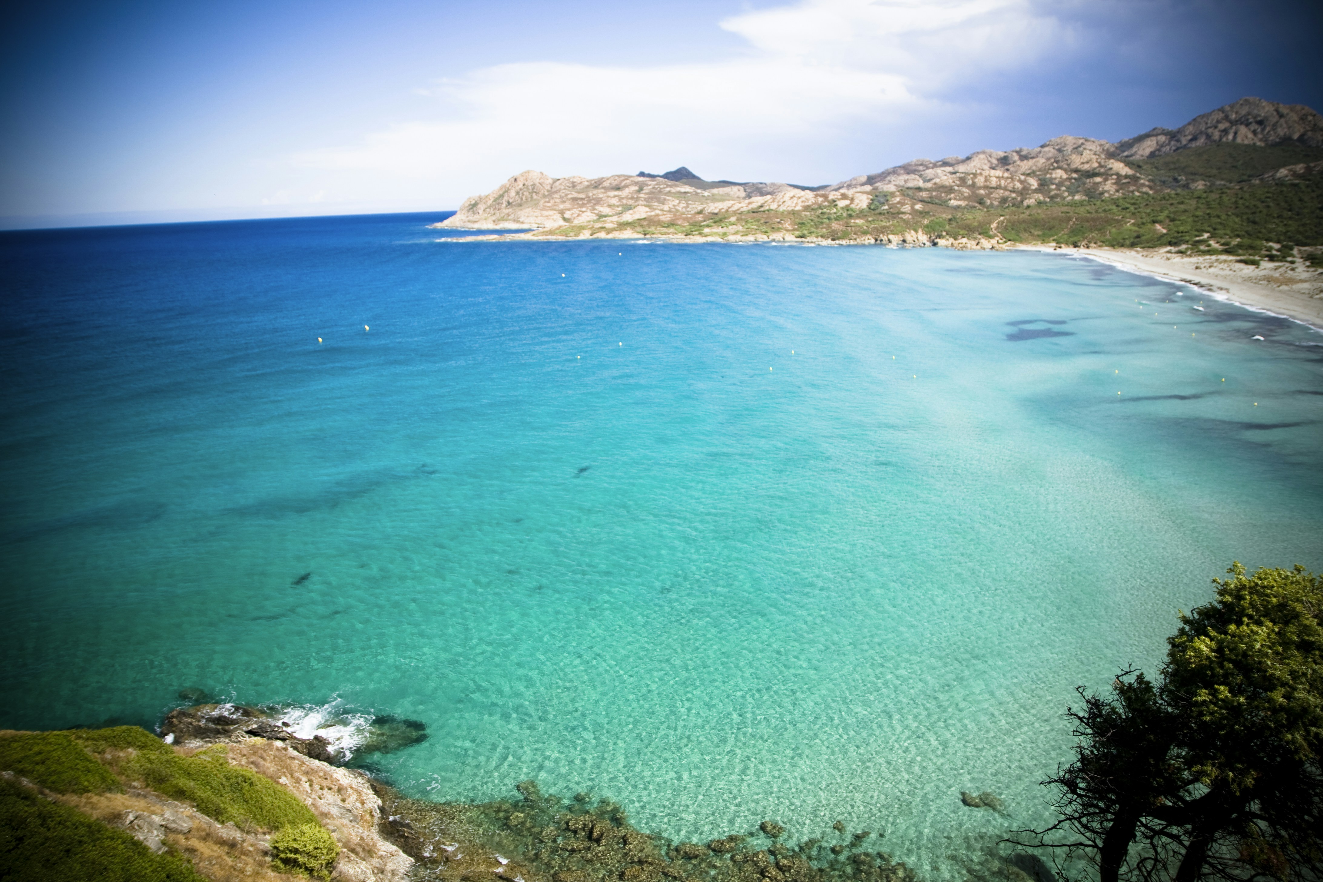 aerial photo of clear blue sea, Sand beach – Plage de Lozari – Corsica