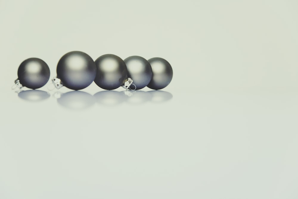 five gray baubles