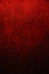 Anodized aluminum sheets with deep crimson finish under natural light