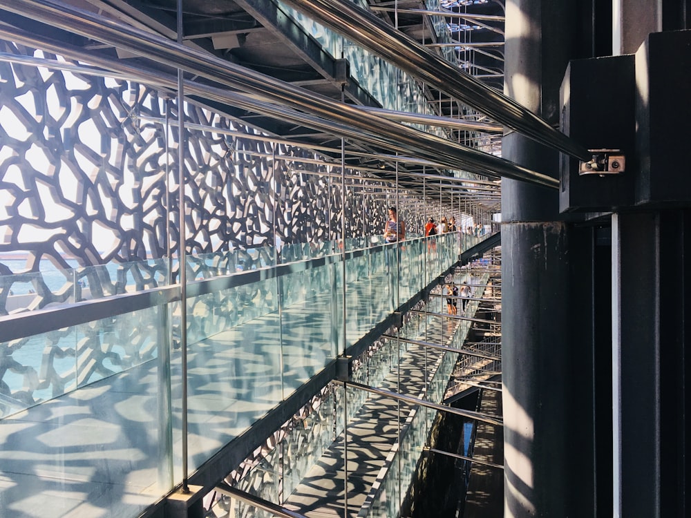 a building with a glass wall and metal railings