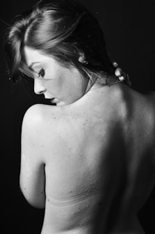 grayscale photo of topless woman