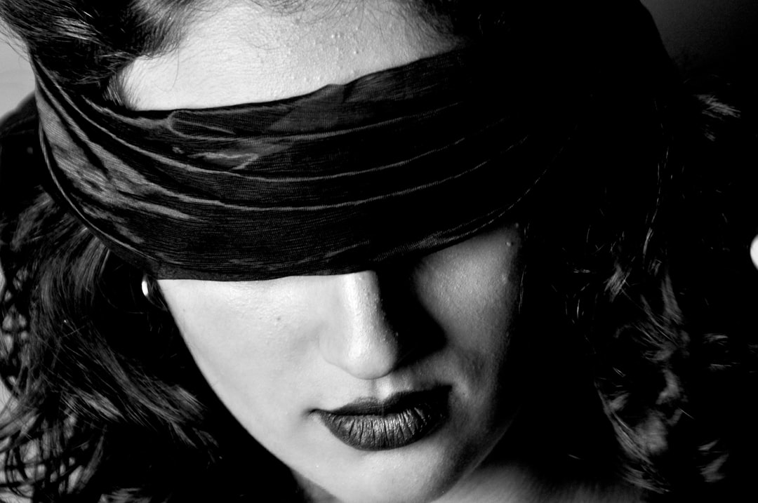 closeup photo of woman with blindfold
