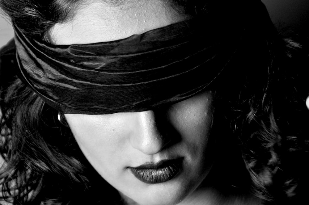 closeup photo of woman with blindfold