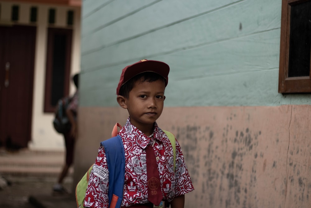 boy standing near wall