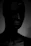 A dark, moody still from a horror film showcasing eerie lighting.