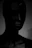 A dark, moody still from a horror film showcasing eerie lighting.