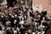 A diverse group of people engaged in a meaningful discussion outdoors.