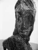 An abstract sculpture made of reclaimed materials, showcasing texture and form