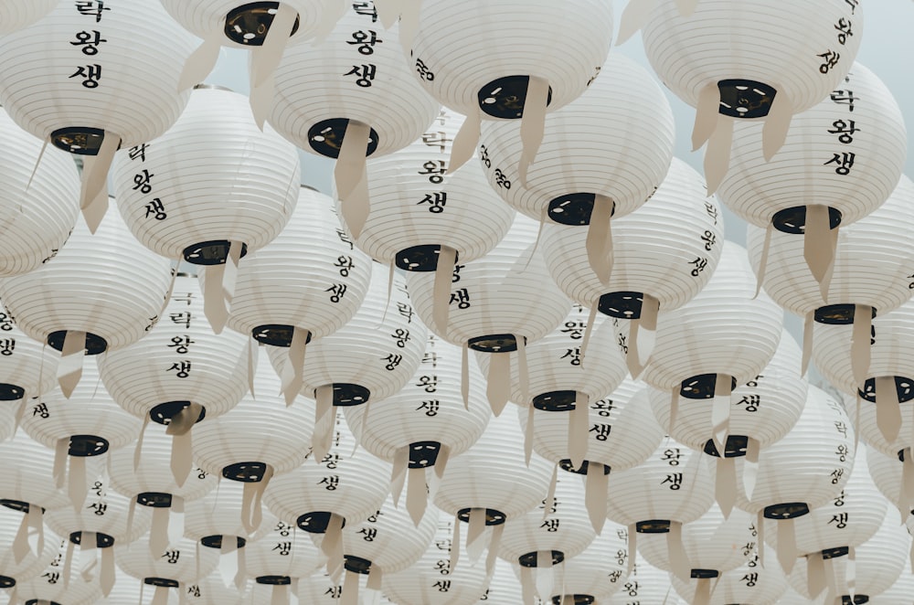 white-and-black paper lanterns during daytime
