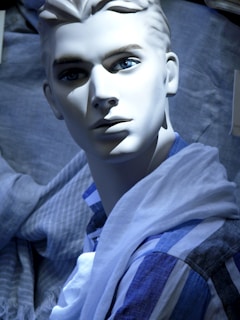 A chic mannequin dressed in a sleek modern outfit against a minimalist white backdrop.