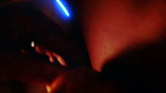 A close-up of a cinematic scene with striking warm and cool color contrasts.