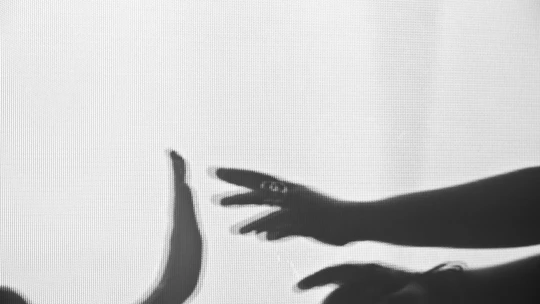 Monochrome image of a handshake symbolizing trust and agreement.
