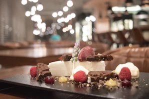 Close-up of a beautifully arranged dessert with rich textures and vibrant colors.