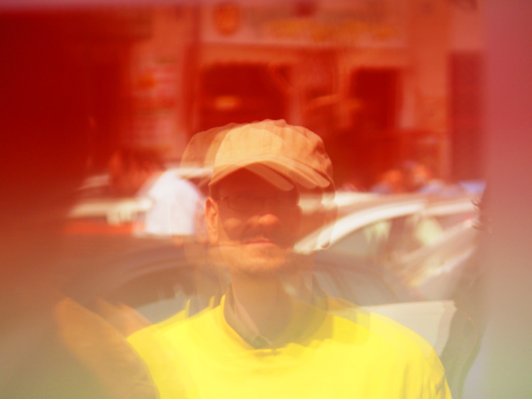man wearing yellow cap and T-shirt