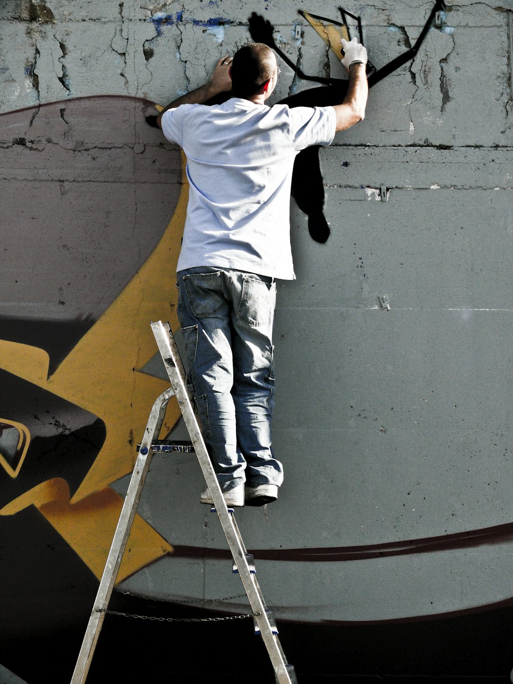 person doing mural paintings