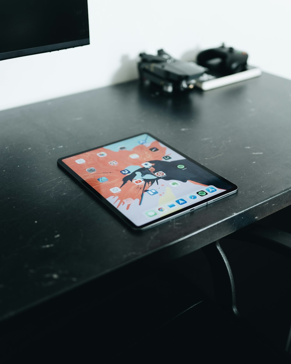 black tablet computer on table