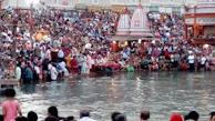 Pilgrims gathered along the banks of the Falgu River preparing for ancestral rites.