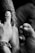 A close-up view of a tattoo being applied to someone's arm by a tattoo artist. The artist's hand is steady as they work on the intricate details of the design. The scene captures the intensity and focus required in tattooing.