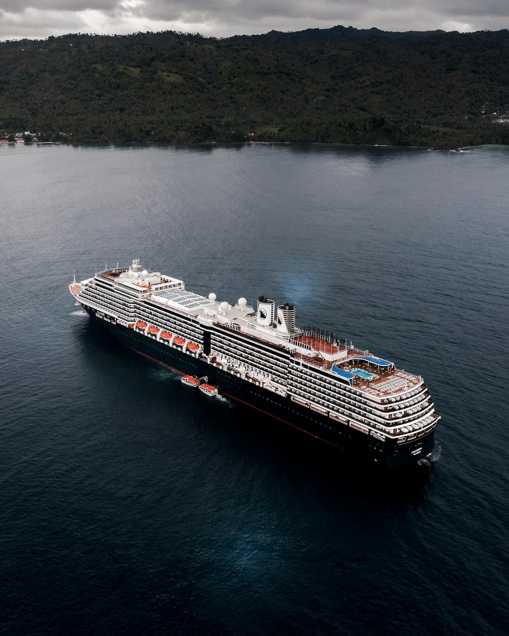 cruise ship on calm body of water