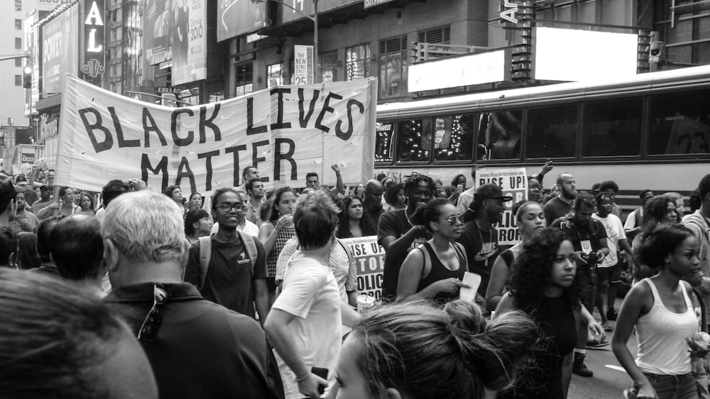 grayscale photo of rally