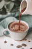 chocolate coffee pouring in white mug