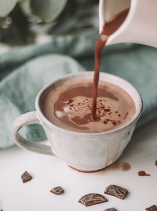chocolate coffee pouring in white mug