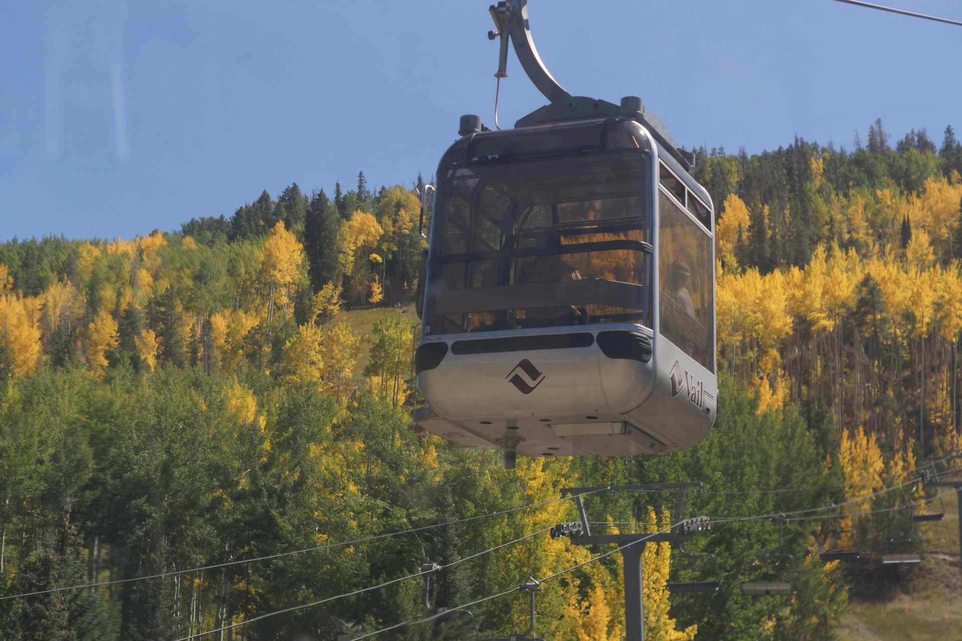 woman wearing yellow long-sleeved dress under white clouds and blue sky during daytime