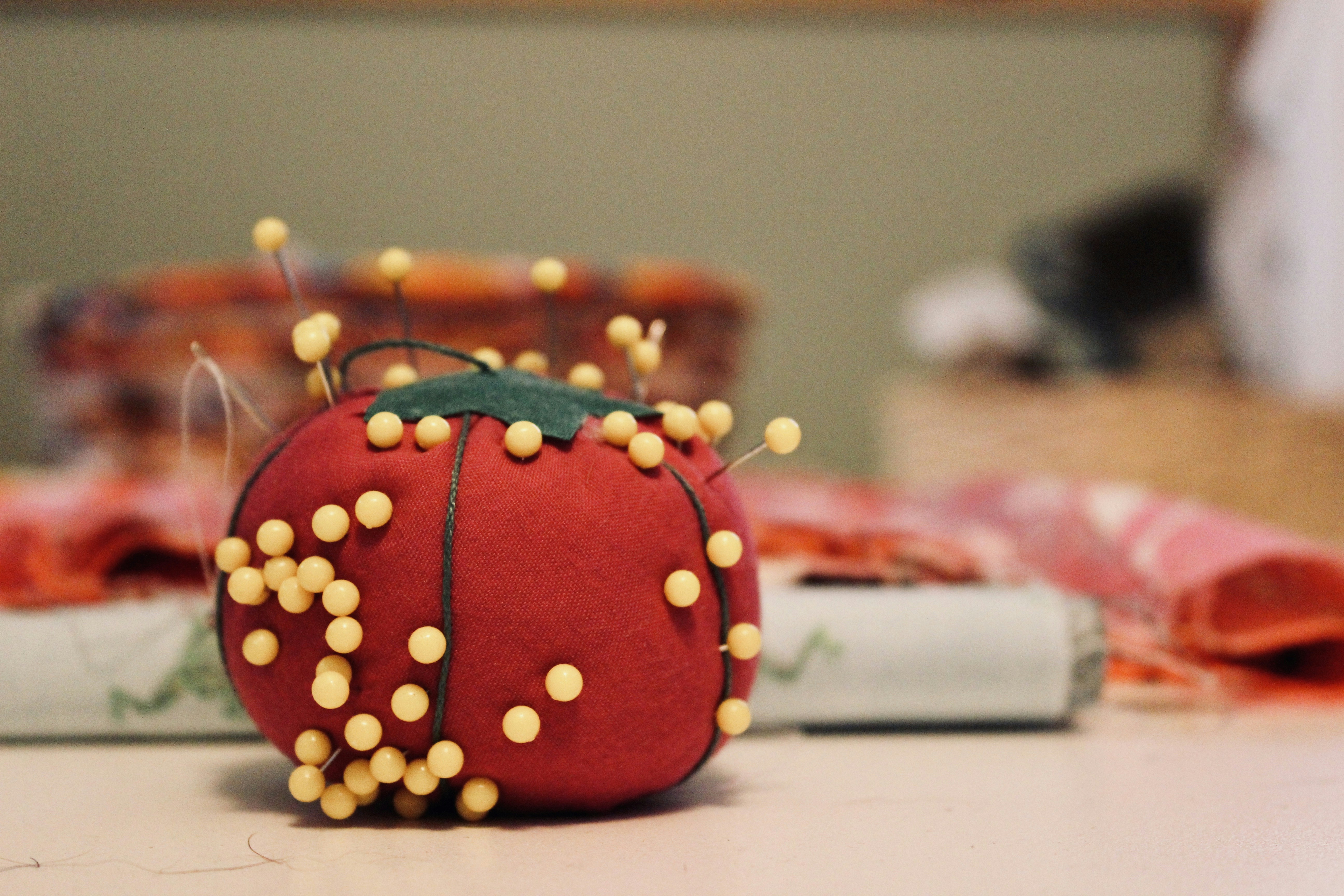 Pin cushion with sewing pins