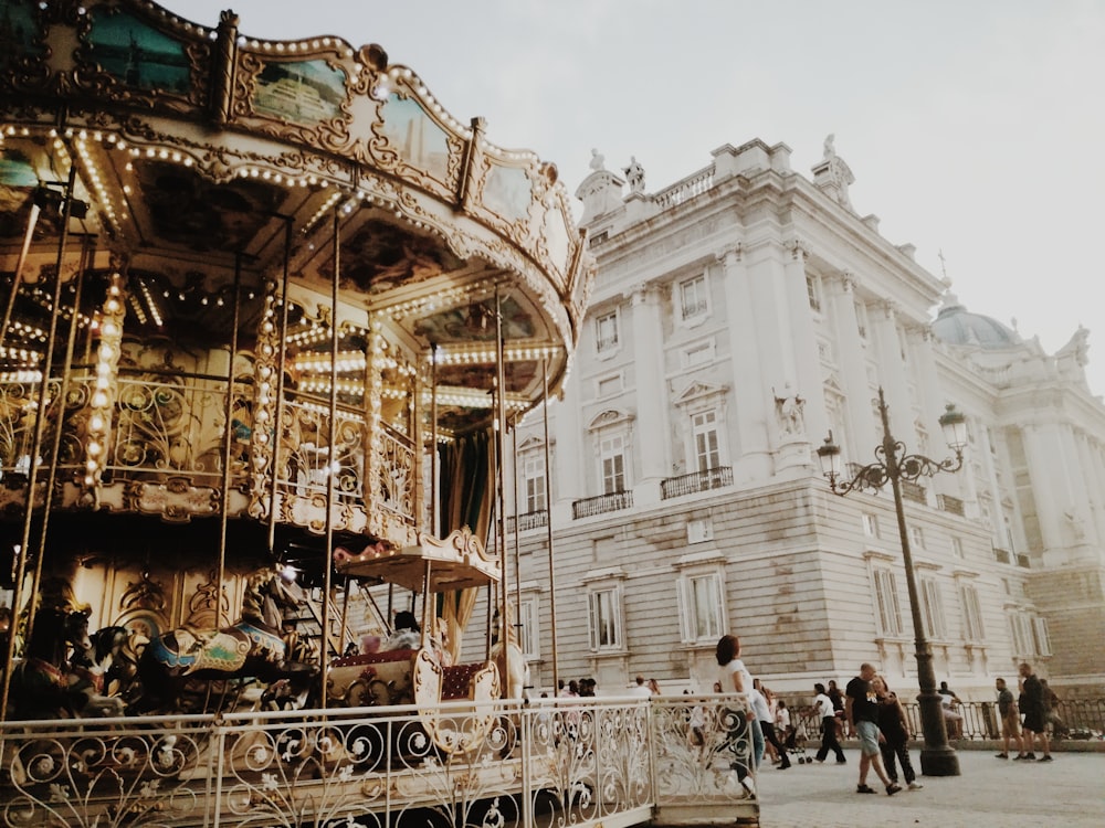 brown carousel beside building