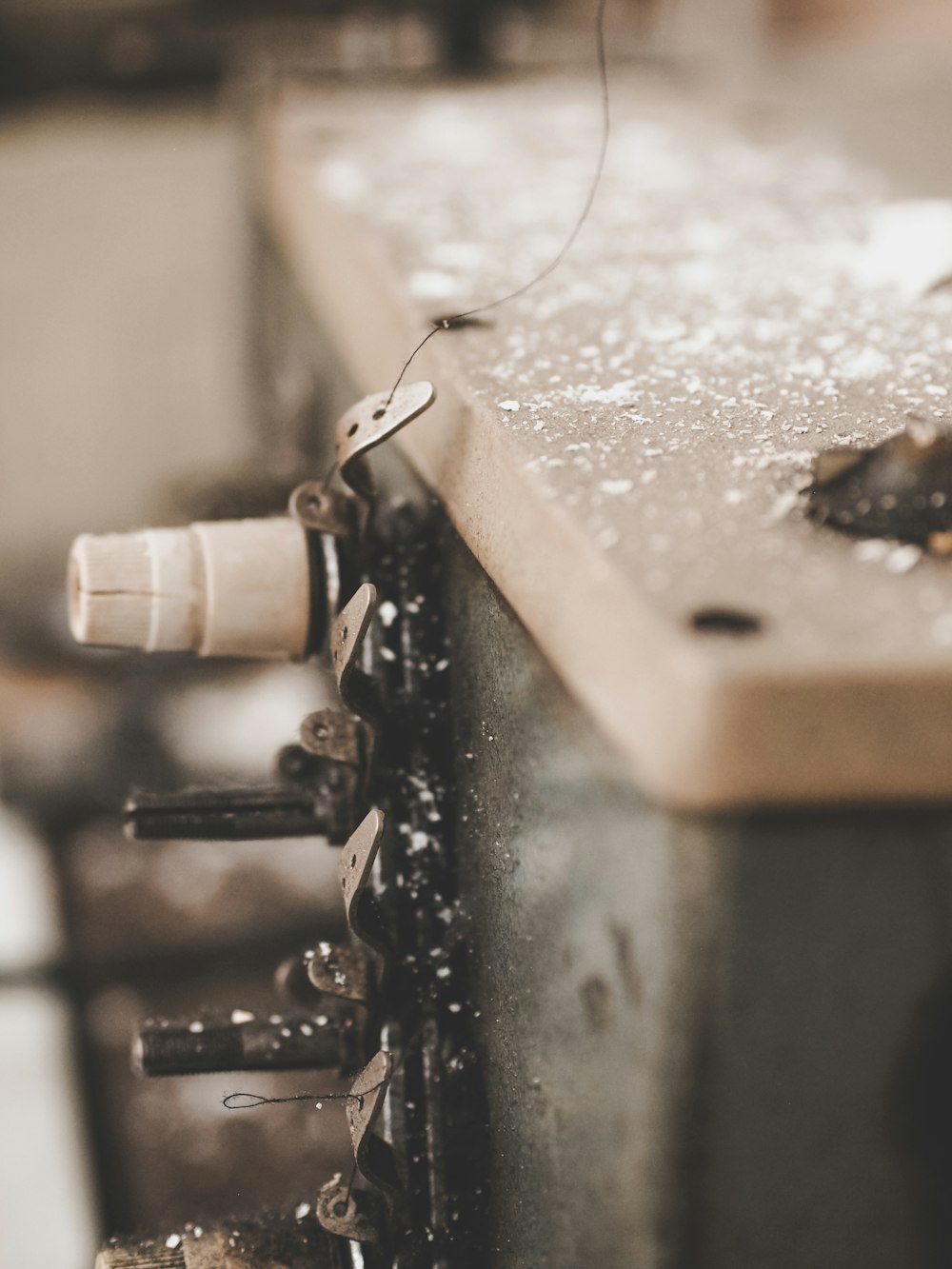 selective focus photography of overlock sewing machine