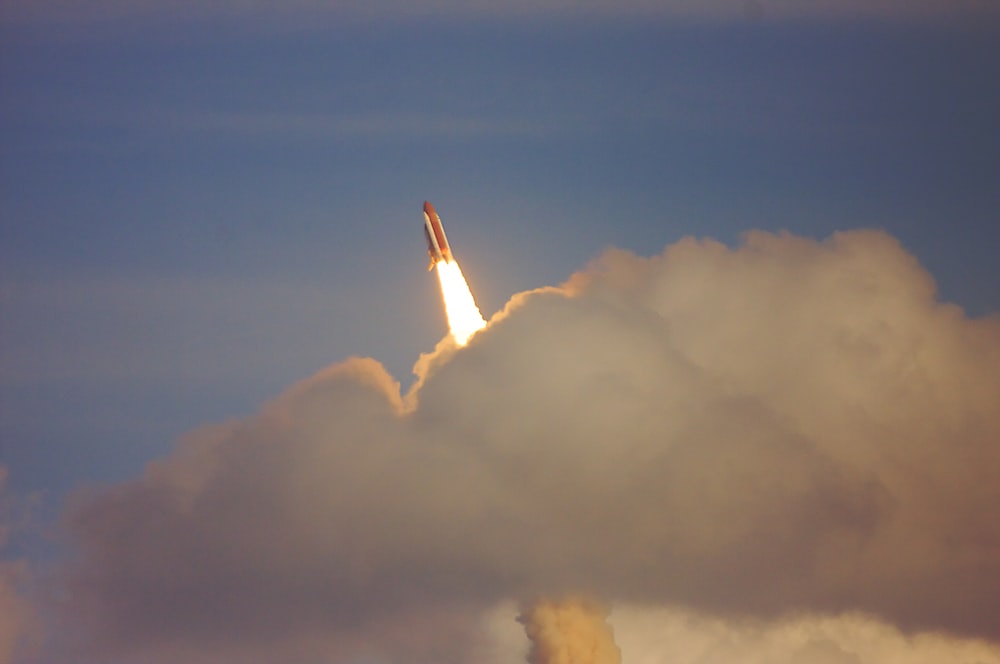 low-angle photography of red space shuttle