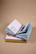 open book on top of several stacked books