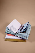 open book on top of several stacked books