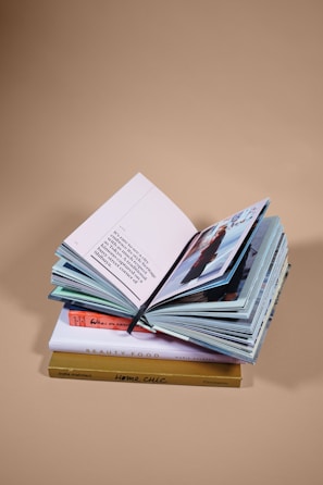 open book on top of several stacked books
