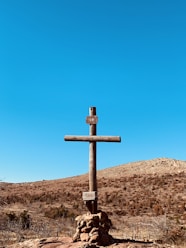 cross on landscape field