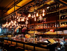 turned-on filament bulb lights at bar counter