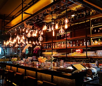 turned-on filament bulb lights at bar counter