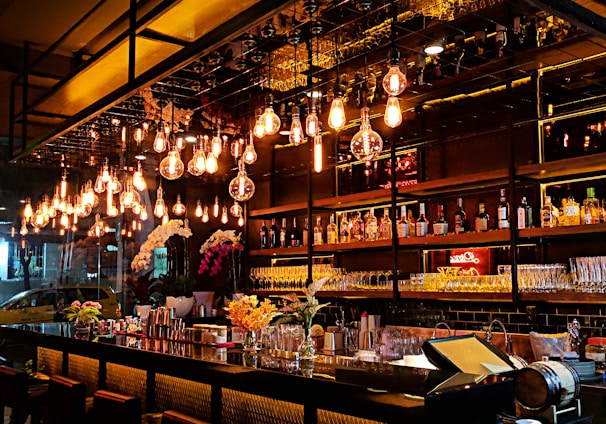 turned-on filament bulb lights at bar counter