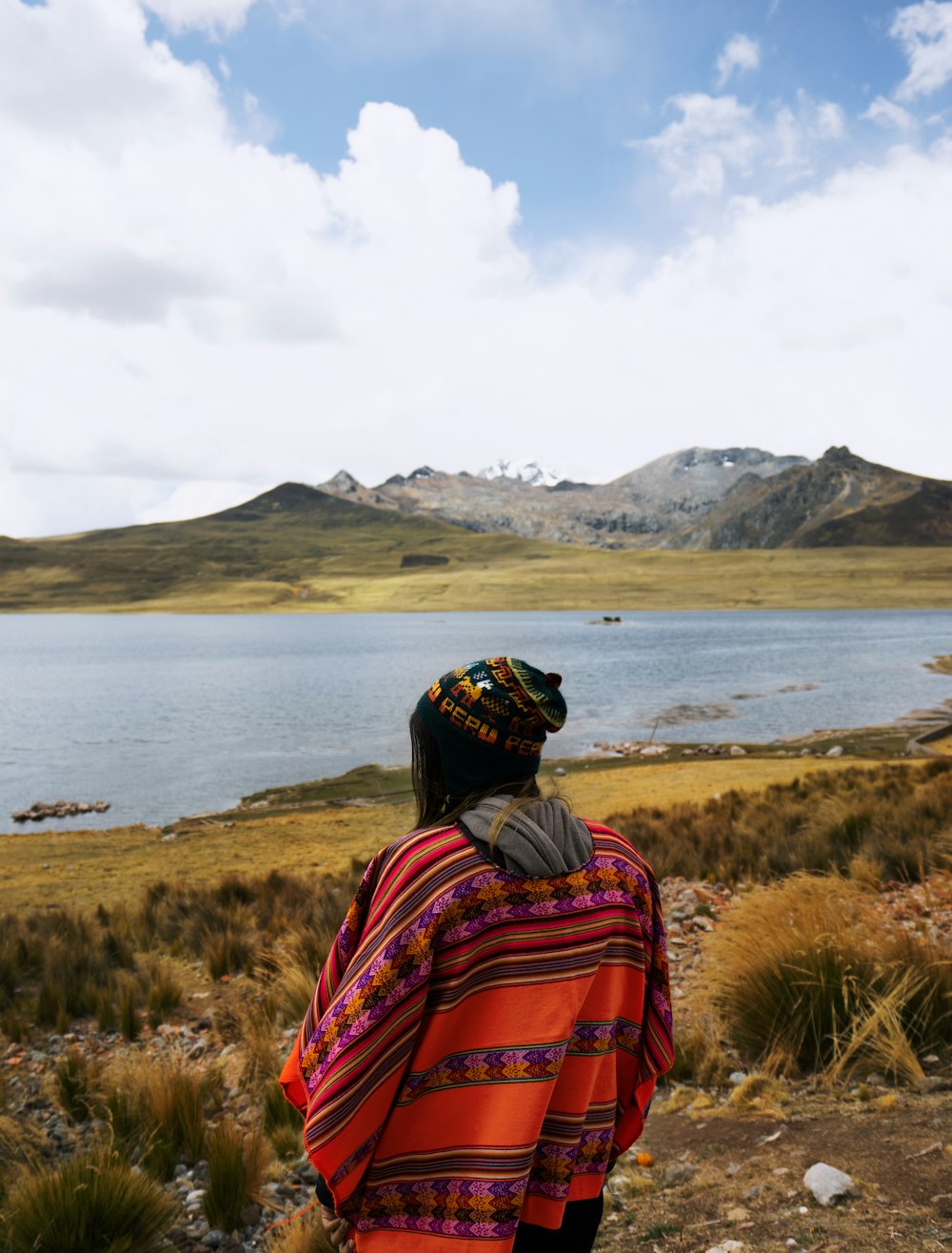 person standing near body of water