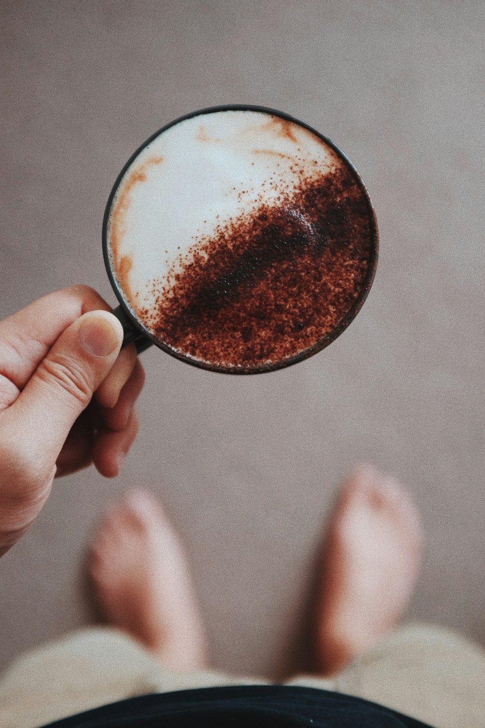 person holding filled cappuccino