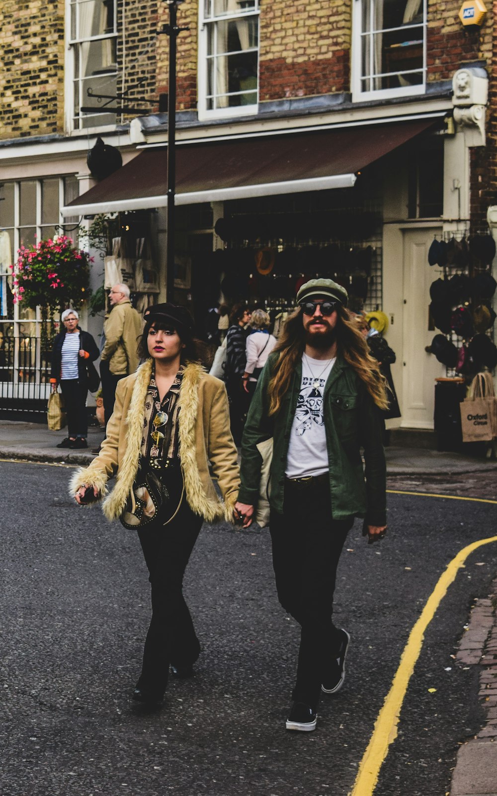 man and woman walking on street