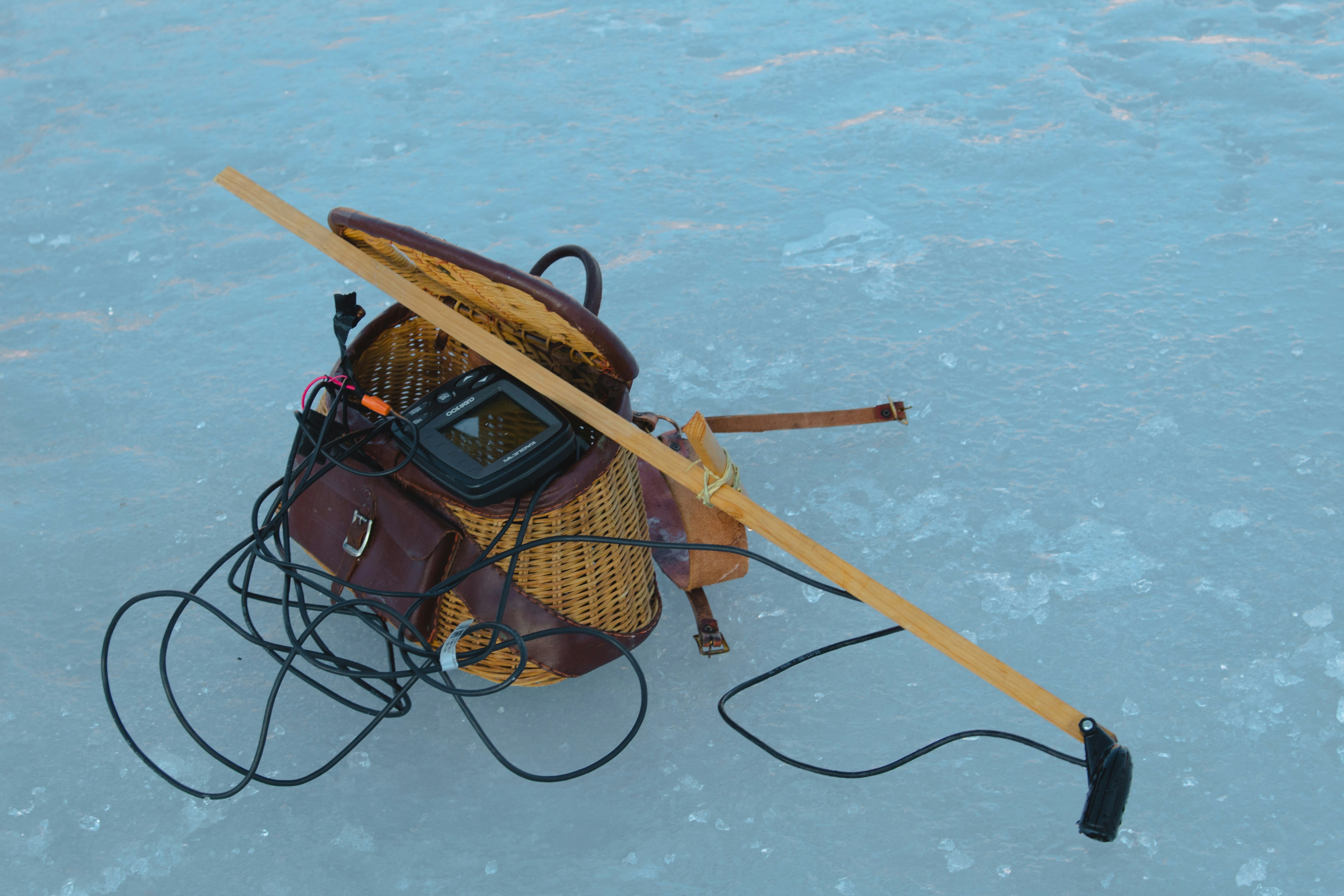 I was skeptical of going out on the frozen reservoir. I’d never done anything like it before and on top of that, there was no one really around. Out of nowhere a man came and showed me the ropes of ice fishing even though I was just there for photos. This was his gear pack he had.