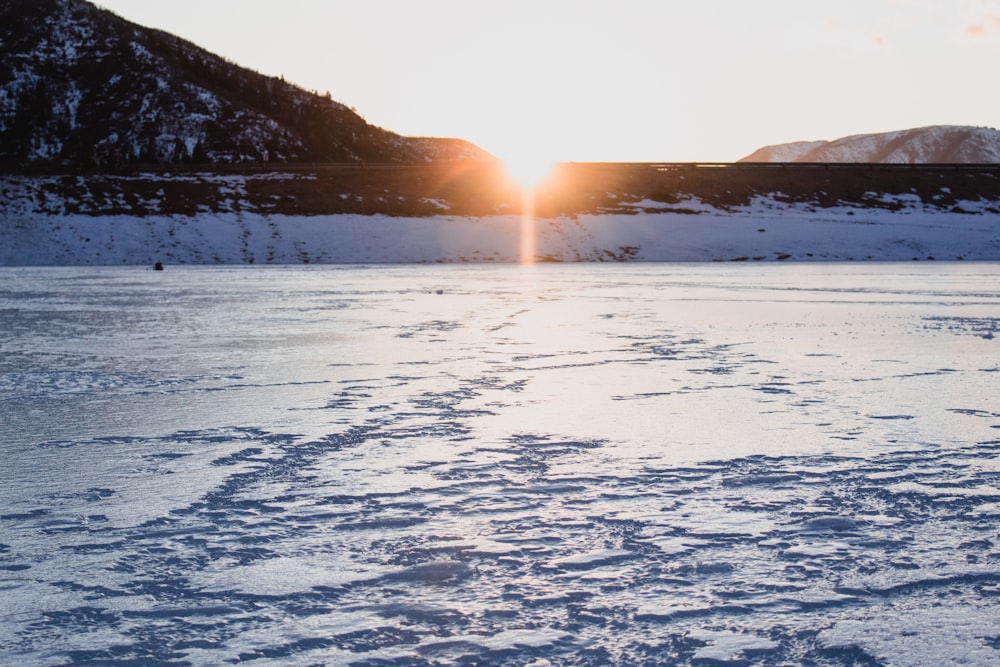 snow terrain in sunrise background